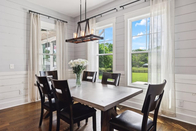 273 Halltown Rd, Cottontown, TN 37048 - dining area with a chandelier, wood walls, and dark wood-style floors