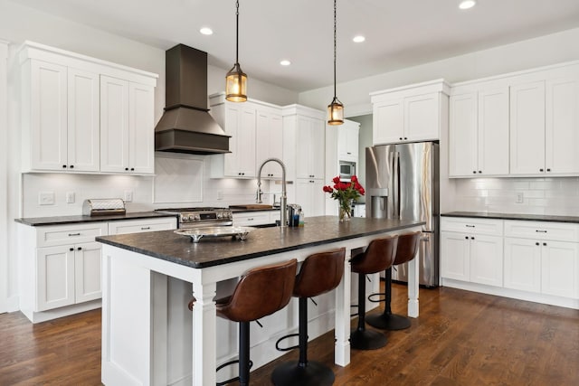 273 Halltown Rd, Cottontown, TN 37048 - kitchen featuring appliances with stainless steel finishes, premium range hood, dark countertops, tasteful backsplash, and recessed lighting