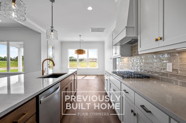 5532 Sinclair St, Murfreesboro, TN 37127 - kitchen featuring a sink, stainless steel appliances, custom exhaust hood, backsplash, and light stone countertops