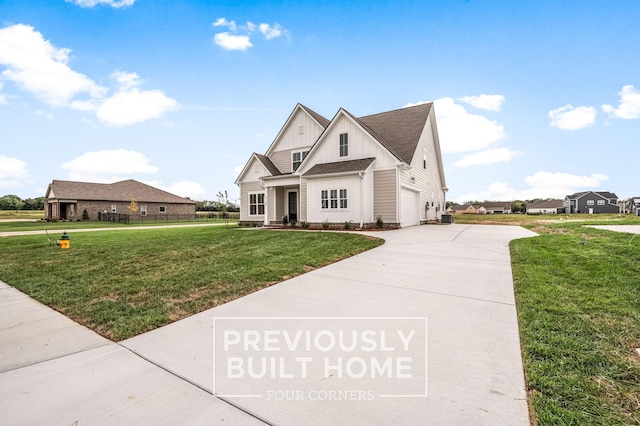 5532 Sinclair St, Murfreesboro, TN 37127 - view of front of house featuring board and batten siding, concrete driveway, a front yard, and roof with shingles