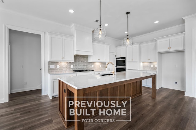 5532 Sinclair St, Murfreesboro, TN 37127 - kitchen with a sink, black stovetop, stainless steel double oven, light countertops, and white cabinetry