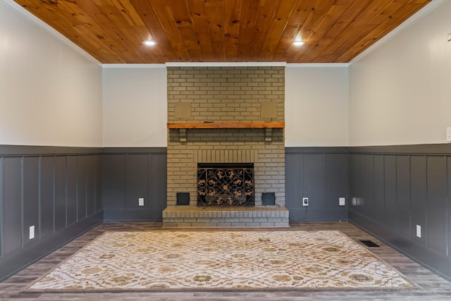 208 Meadowgreen Dr, Franklin, TN 37069 - unfurnished living room featuring ornamental molding, wainscoting, wooden ceiling, wood finished floors, and a fireplace