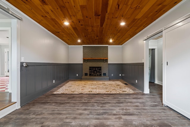 208 Meadowgreen Dr, Franklin, TN 37069 - unfurnished living room featuring ornamental molding, wooden ceiling, a wainscoted wall, wood finished floors, and a fireplace