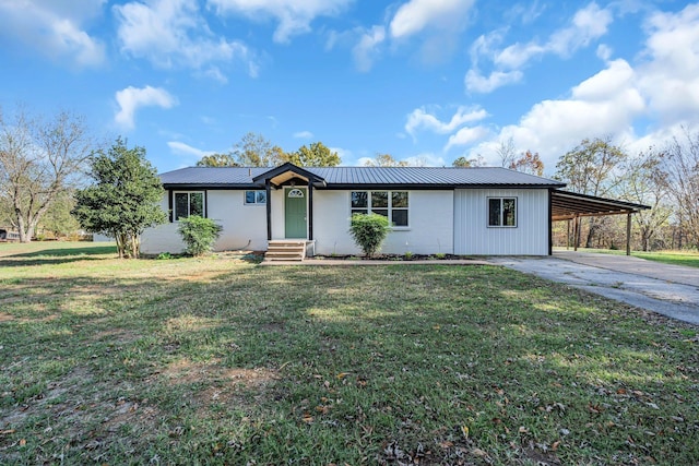 10 Grinnell Dr, Lawrenceburg, TN 38464 - view of front facade with concrete driveway, an attached carport, a front lawn, and metal roof