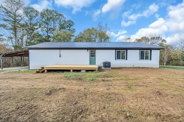 10 Grinnell Dr, Lawrenceburg, TN 38464 - back of house with metal roof, brick siding, a deck, and an attached carport