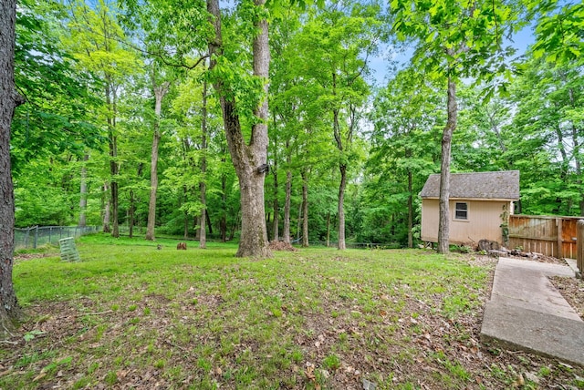 view of yard featuring an outbuilding and a shed