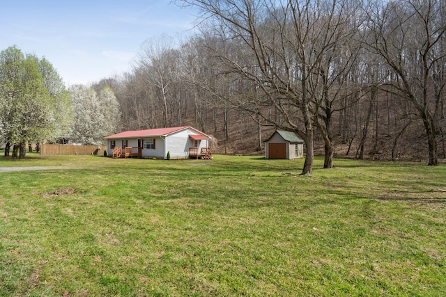 view of yard with a storage unit and an outdoor structure