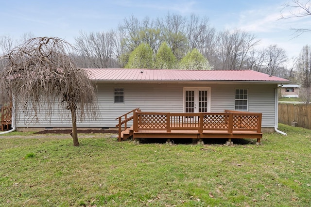 rear view of house featuring french doors, metal roof, a wooden deck, and crawl space