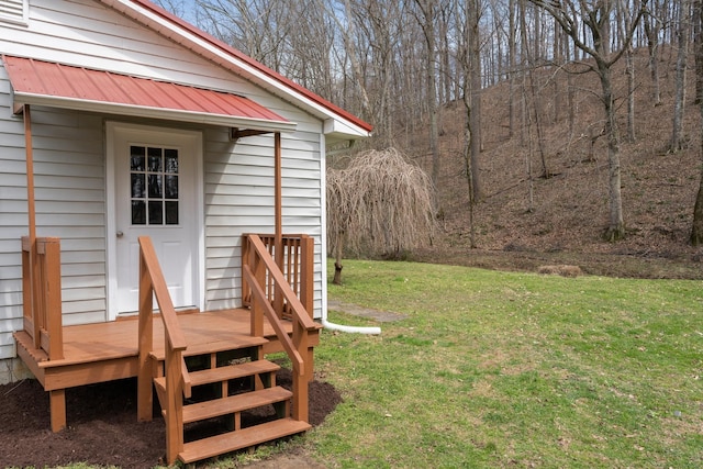 view of green lawn with a deck