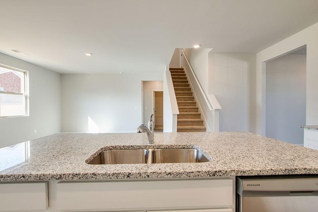 4017 Roane Dr, White House, TN 37188 - kitchen with dishwasher, a sink, light stone countertops, white cabinetry, and recessed lighting