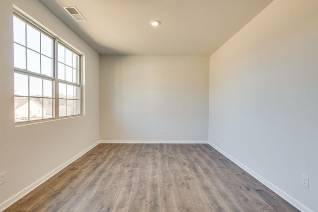 4017 Roane Dr, White House, TN 37188 - empty room with wood finished floors, baseboards, and recessed lighting