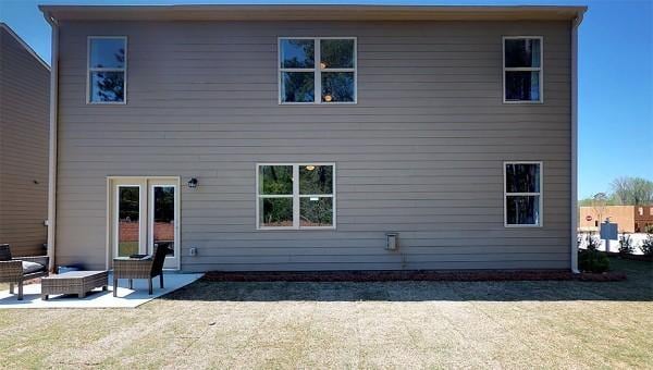 4017 Roane Dr, White House, TN 37188 - rear view of house with a patio and an outdoor hangout area