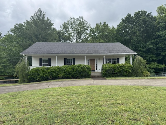 single story home with a porch and driveway