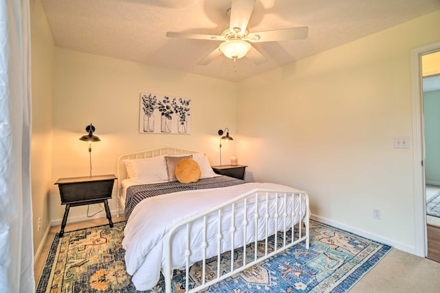 bedroom with baseboards, a ceiling fan, and carpet floors