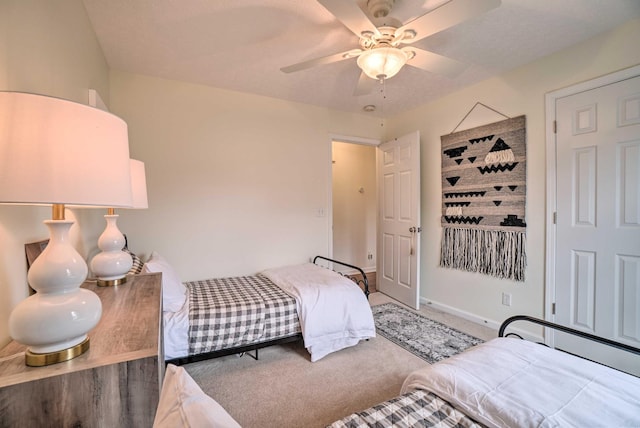 bedroom with carpet, baseboards, and ceiling fan