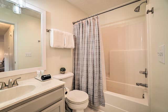 full bath with shower / bath combination with curtain, toilet, vanity, and a textured ceiling
