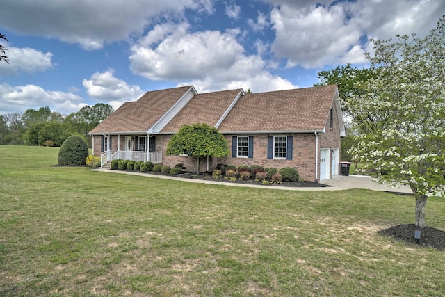 view of front of house featuring brick siding, a porch, and a front yard