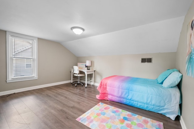 407 High St, Dickson, TN 37055 - bedroom featuring lofted ceiling, wood finished floors, and baseboards