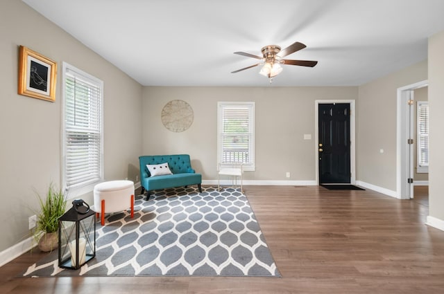 407 High St, Dickson, TN 37055 - living area with wood finished floors, baseboards, and ceiling fan