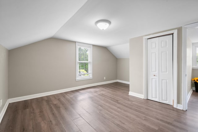 407 High St, Dickson, TN 37055 - additional living space featuring wood finished floors, baseboards, and vaulted ceiling