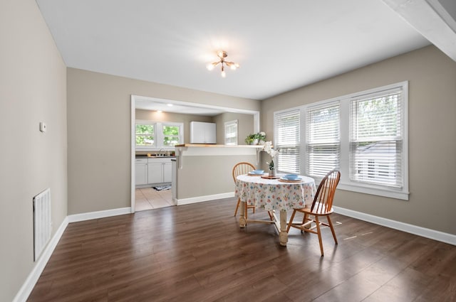 407 High St, Dickson, TN 37055 - dining area featuring baseboards and wood finished floors