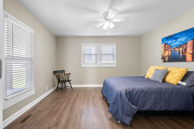 407 High St, Dickson, TN 37055 - bedroom featuring wood finished floors, multiple windows, baseboards, and ceiling fan