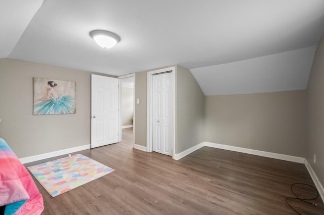 407 High St, Dickson, TN 37055 - additional living space with wood finished floors, baseboards, and vaulted ceiling