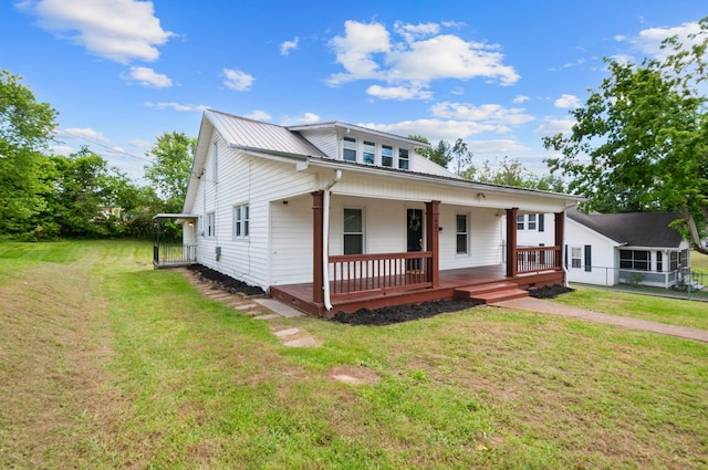 407 High St, Dickson, TN 37055 - view of front of house featuring a porch, a front lawn, and metal roof