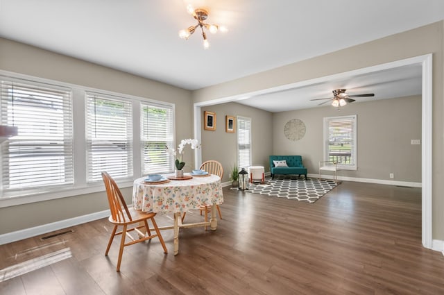 407 High St, Dickson, TN 37055 - dining room featuring baseboards, wood finished floors, a chandelier, and ceiling fan