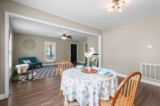 407 High St, Dickson, TN 37055 - dining space featuring wood finished floors, baseboards, a chandelier, and ceiling fan