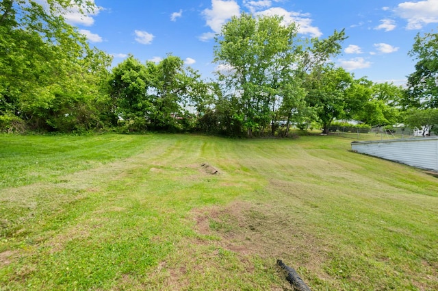 407 High St, Dickson, TN 37055 - view of grassy yard with view of wooded area