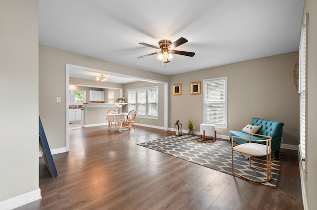 407 High St, Dickson, TN 37055 - living area with wood finished floors, a ceiling fan, and baseboards