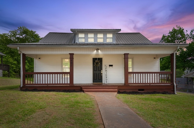 407 High St, Dickson, TN 37055 - view of front of property with a porch, a lawn, and metal roof