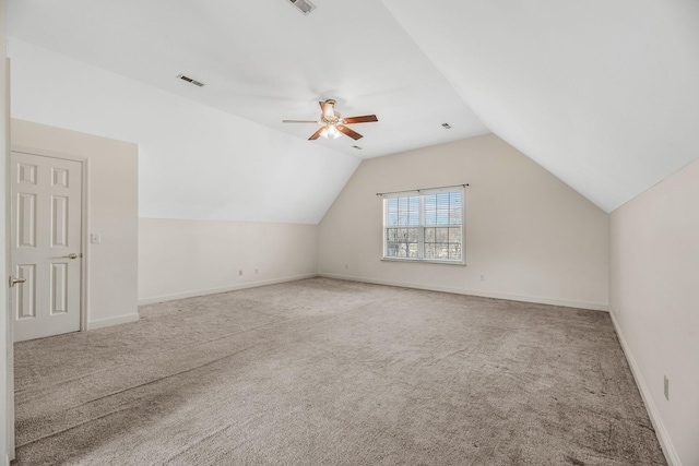 bonus room featuring carpet flooring, lofted ceiling, ceiling fan, and baseboards