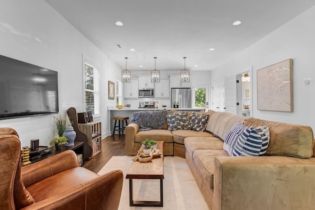 living area featuring recessed lighting and wood finished floors