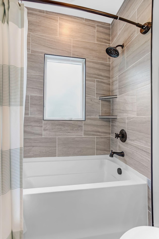 bathroom with shower / bath combination with curtain