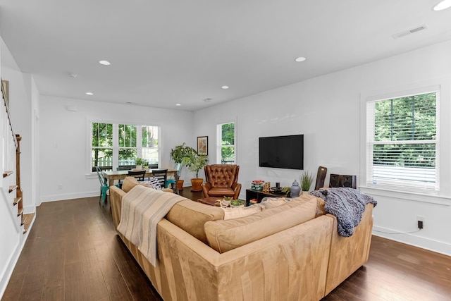 living room featuring dark wood-style floors, stairs, baseboards, and recessed lighting