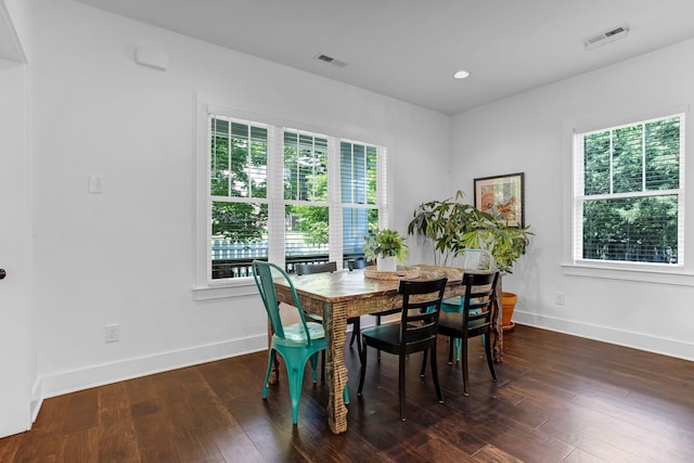 dining area featuring baseboards, hardwood / wood-style floors, and recessed lighting