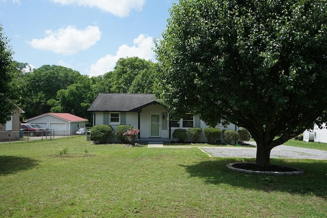 view of front facade with a detached garage