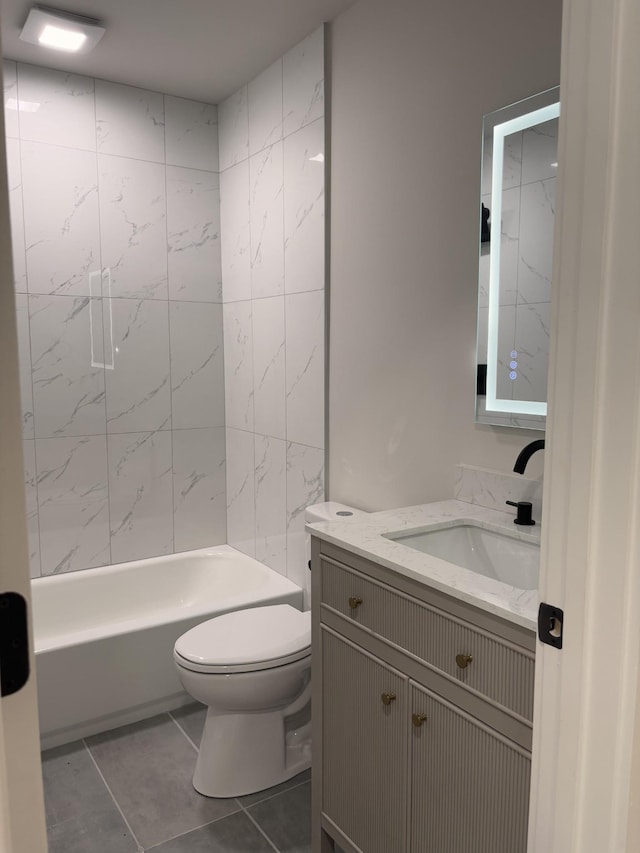 full bath with toilet, tile patterned floors, vanity, and bathing tub / shower combination