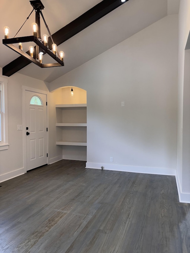entrance foyer featuring a chandelier, baseboards, and dark wood-style flooring