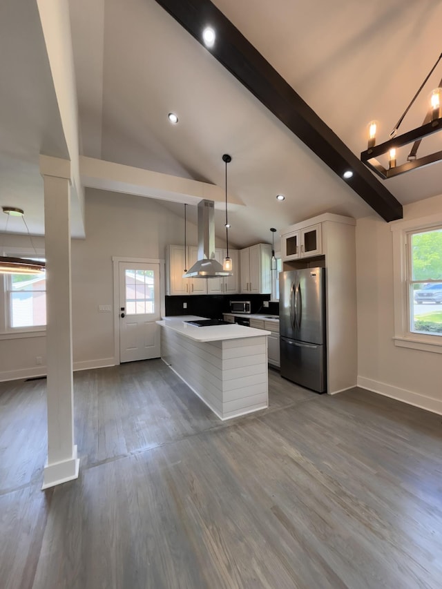 kitchen with stainless steel appliances, island range hood, beamed ceiling, baseboards, and dark wood finished floors