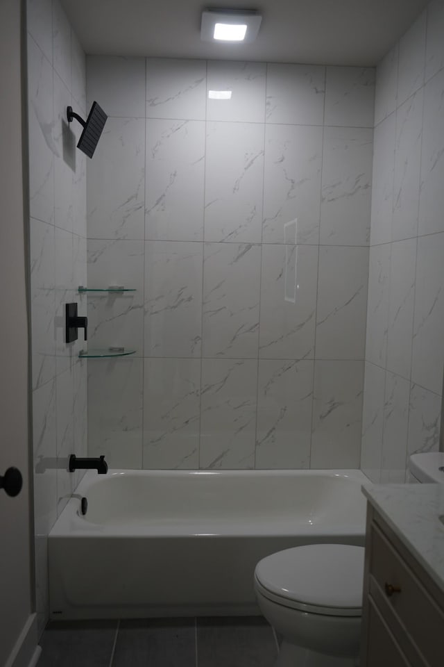 full bathroom featuring toilet, shower / washtub combination, vanity, and tile patterned flooring