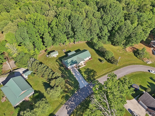 aerial view of property's location featuring a heavily wooded area