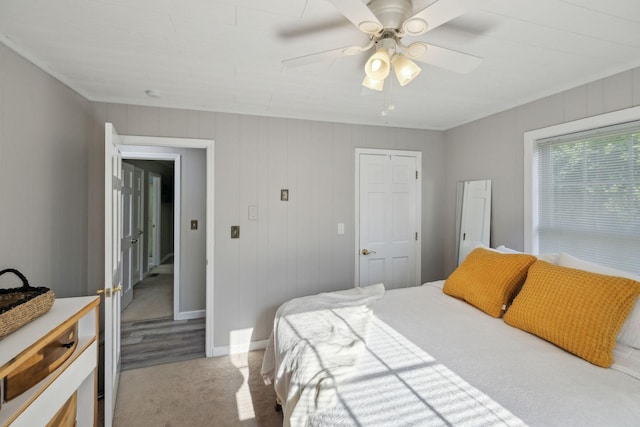 bedroom featuring ceiling fan, carpet flooring, and baseboards