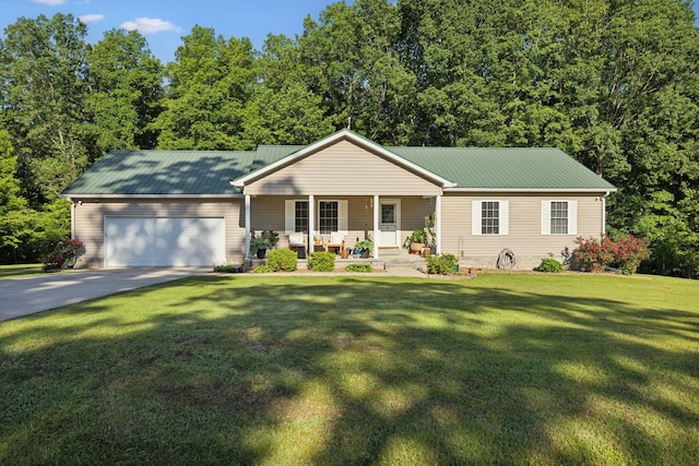 ranch-style house featuring a porch, an attached garage, concrete driveway, a front lawn, and metal roof