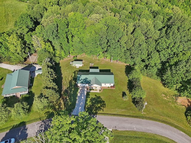 aerial view of property's location with a forest
