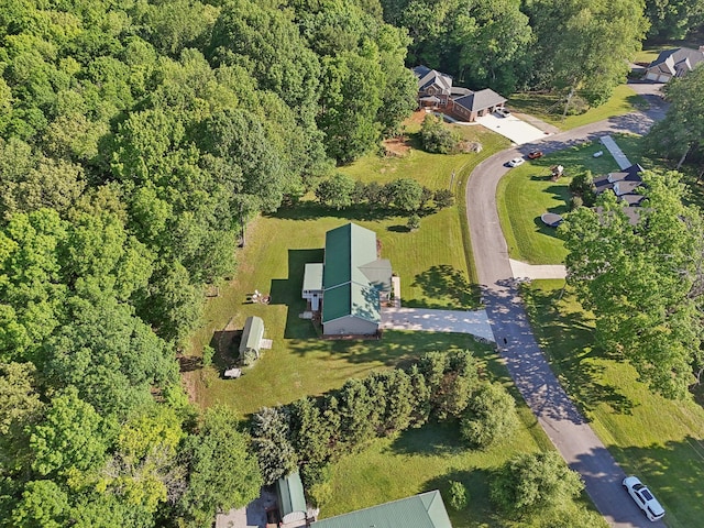 aerial view of property's location with a forest