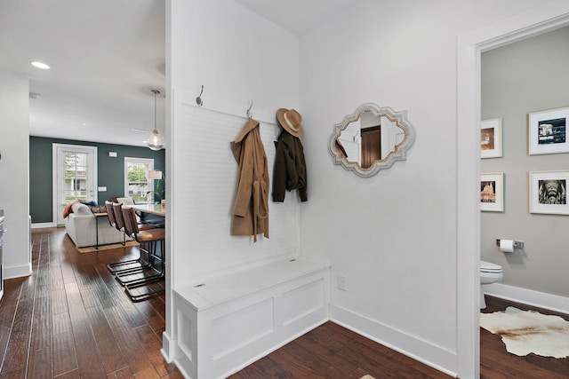 mudroom with dark wood-type flooring, recessed lighting, and baseboards