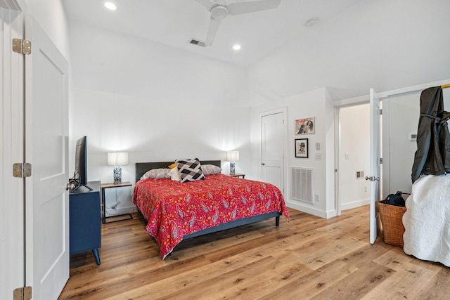bedroom featuring light wood-type flooring, recessed lighting, ceiling fan, and baseboards